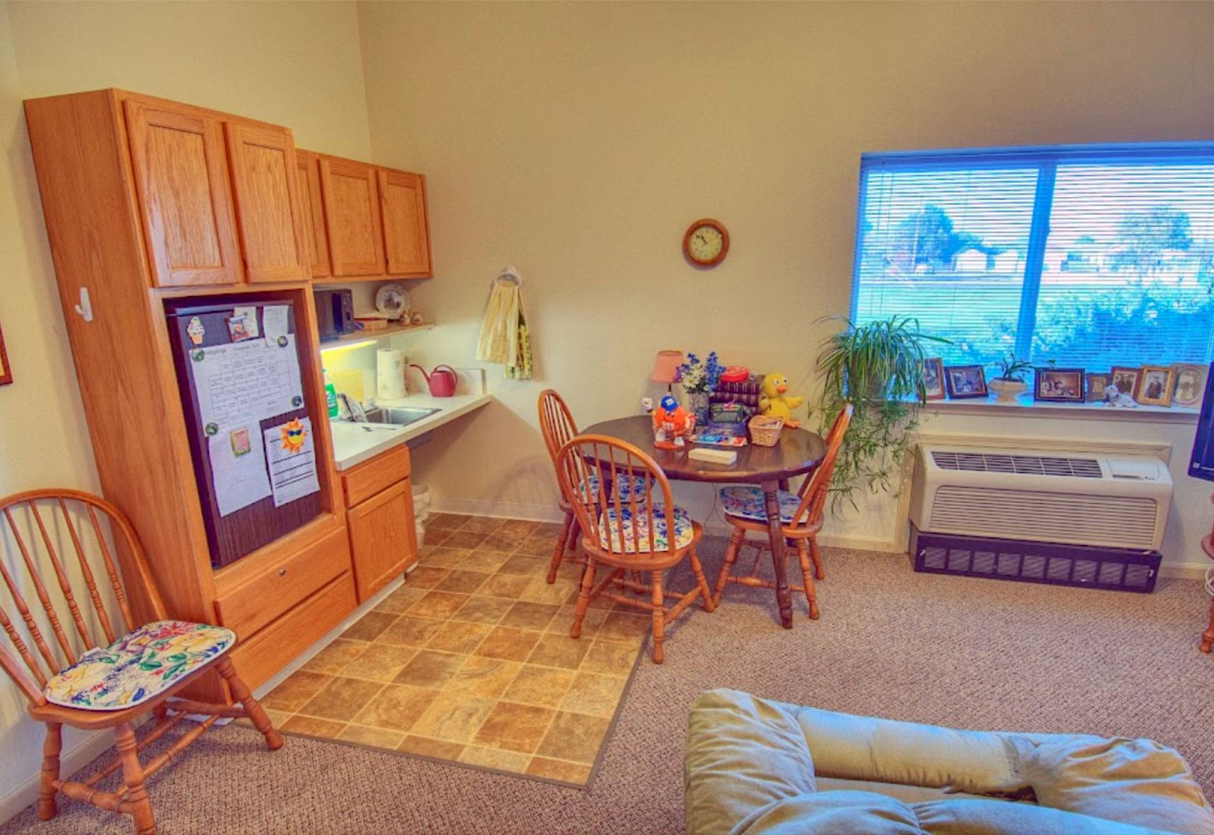 Cozy interior of a resident's room with a kitchenette
