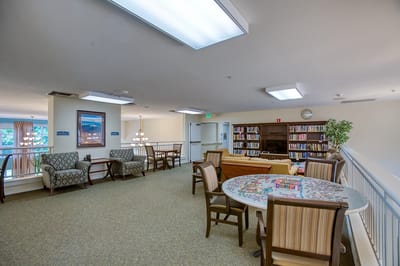Common area with seating and bookshelves
