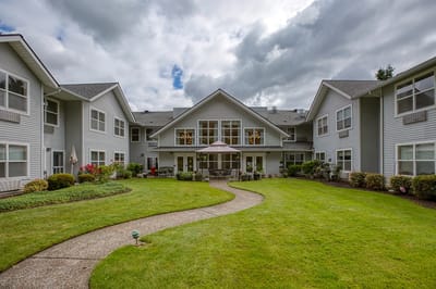 Garden area with pathways and seating in a senior living facility