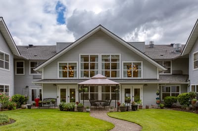 Exterior view of the assisted living facility with garden area
