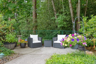 Cozy outdoor seating area with vibrant flowers