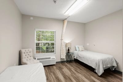 Minimalist private resident room with two beds