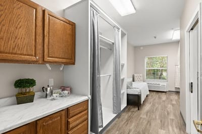 Interior view of a resident's room with furniture