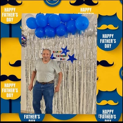 Resident celebrating Father's Day with decorations