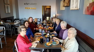 Residents enjoying a meal together in a dining area