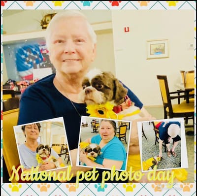 Residents celebrating National Pet Photo Day with dogs