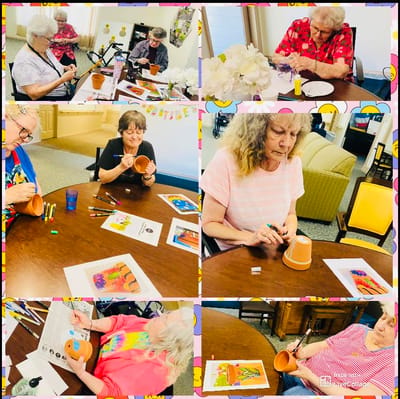 Residents engaged in a creative activity in an activity room