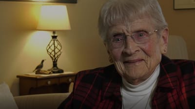 Smiling senior woman in a cozy living room