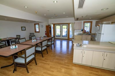 Bright dining room area with tables and chairs