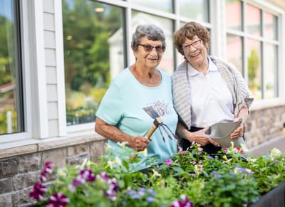 The Village at Lifequest, nursing home in Quakertown, PA — Two seniors gardening by a sunny window