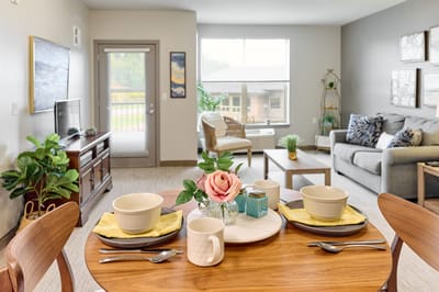 Cozy common area with a dining table set for a meal