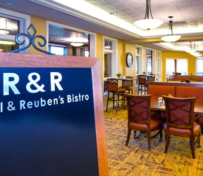 Dining area with sign for Reuben's Bistro