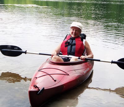 Spiritrust Lutheran – the Village at Sprenkle Drive, nursing home in York, PA — Senior woman kayaking on a calm lake