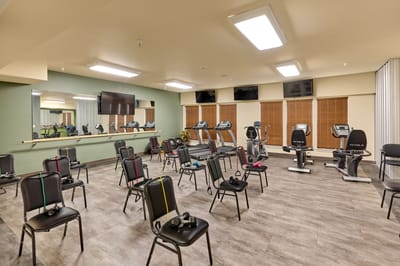 Interior view of a fitness room with exercise equipment