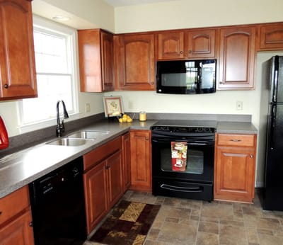 Kitchen interior with wooden cabinets and appliances