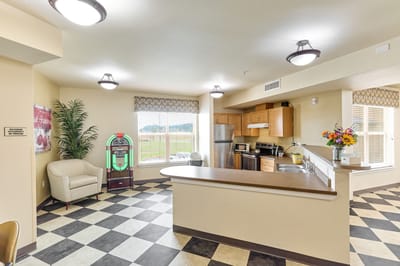 Common area featuring seating and a jukebox