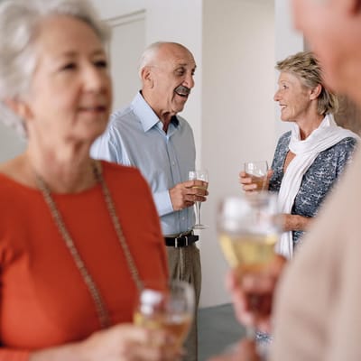 Spiritrust Lutheran – the Village at Sprenkle Drive, nursing home in York, PA — Seniors socializing with drinks in a communal setting