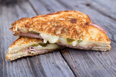Lehigh Commons, nursing home in Macungie, PA — Grilled cheese sandwich with ham and pickles on wood