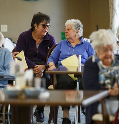 Residents engaging in conversation in a common area