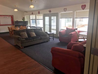 Lounge area with seating and large windows