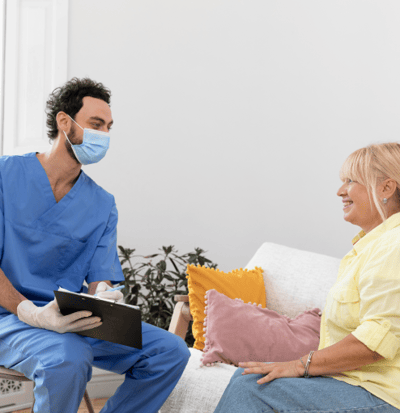 Nurse talking to a resident in a common area