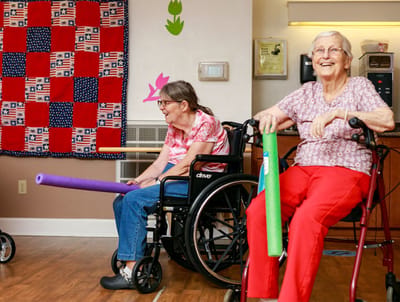 Residents participating in an activity in a bright room