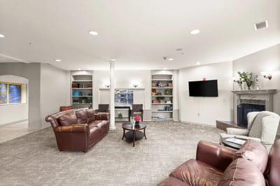 Comfortable lounge area with seating and bookshelves