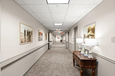 Bright hallway with artwork and furniture