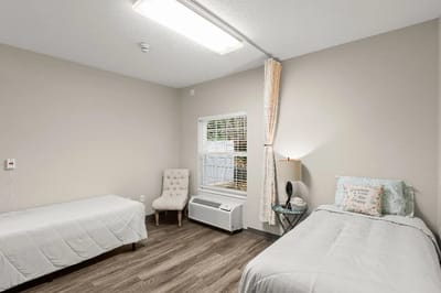 A cozy private resident room with two beds