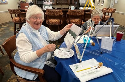 Residents enjoying an art activity in a common area