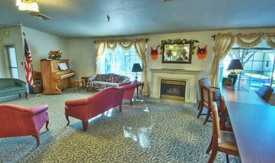 Common area with seating and décor in a senior living facility