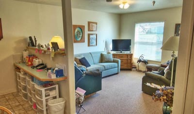 Cozy living area inside a resident's room