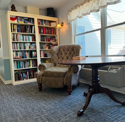 Cozy reading nook with a bookshelf and armchair