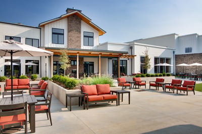 Outdoor seating area with modern furniture and landscaping