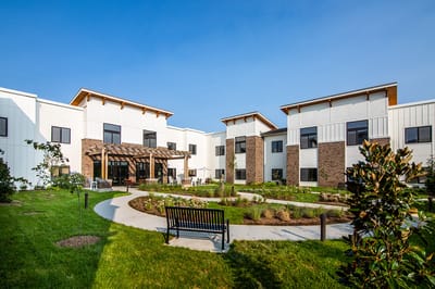 Exterior view of Barnes Place with landscaped garden