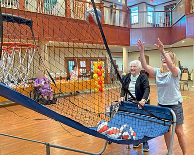 Residents participating in an indoor basketball game