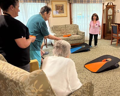 Residents playing a game in a common area