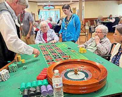 Residents engaged in a fun gaming activity at a common area
