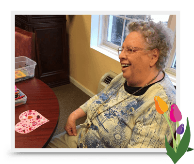 Resident enjoying activities at a table