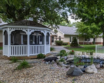 A gazebo in a landscaped outdoor area