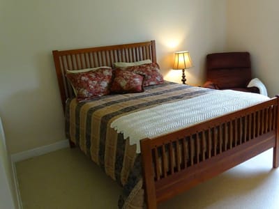 Cozy private resident room with a bed and lamp