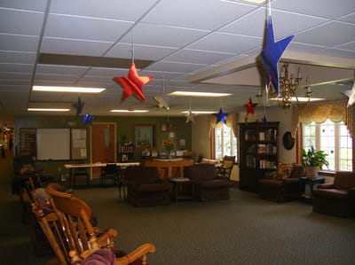 Interior view of a cozy common area with festive decorations