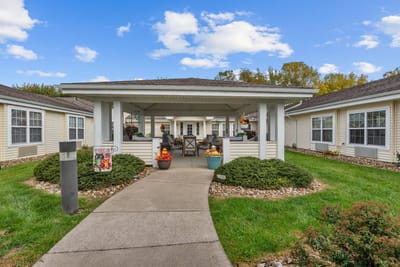 Outdoor area of a senior living facility with seating and decor