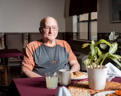 Senior man enjoying a meal in a dining area