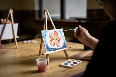 Residents participating in a painting activity