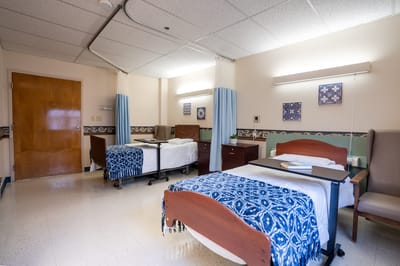 A shared resident room with beds and decor