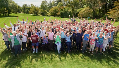 Large group of residents celebrating outdoors