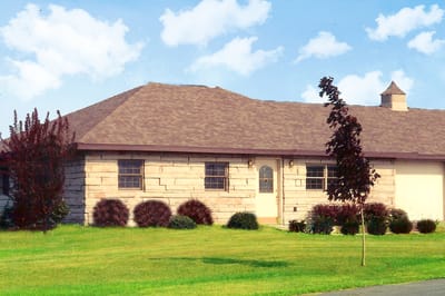 Exterior view of a building with gardens