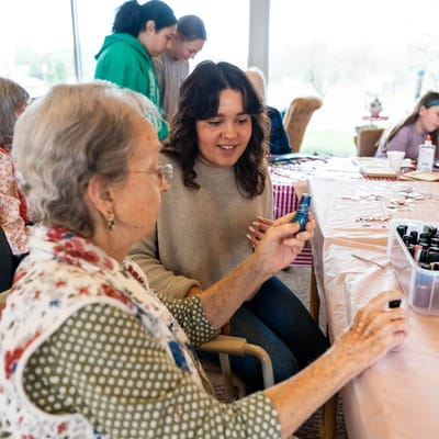 Residents and staff enjoying a crafting activity