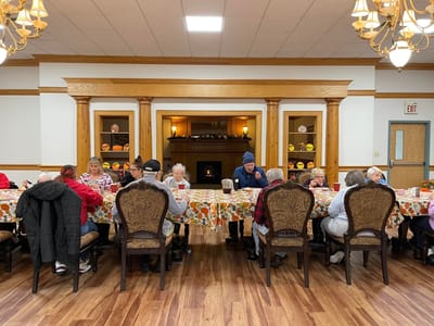 Residents enjoying a meal in the dining room